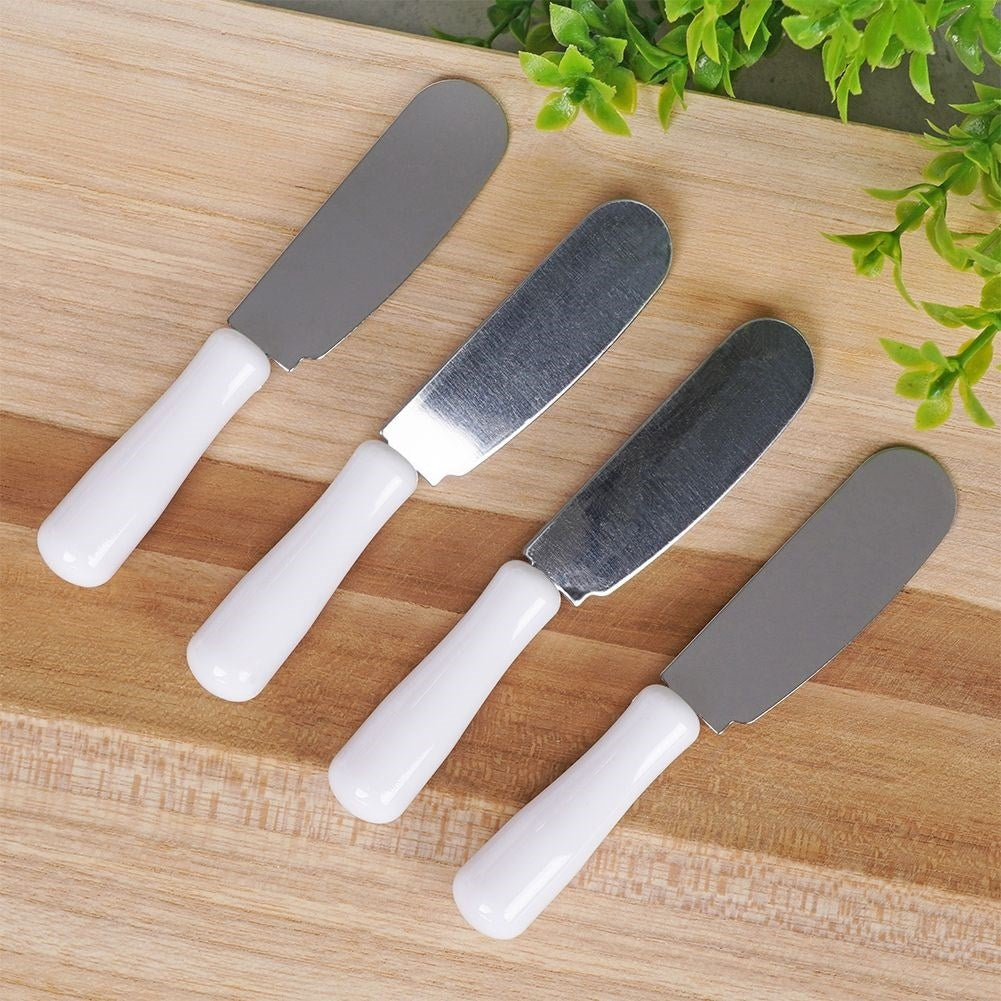 Four stainless steel knives for butter, cheeses and toppings