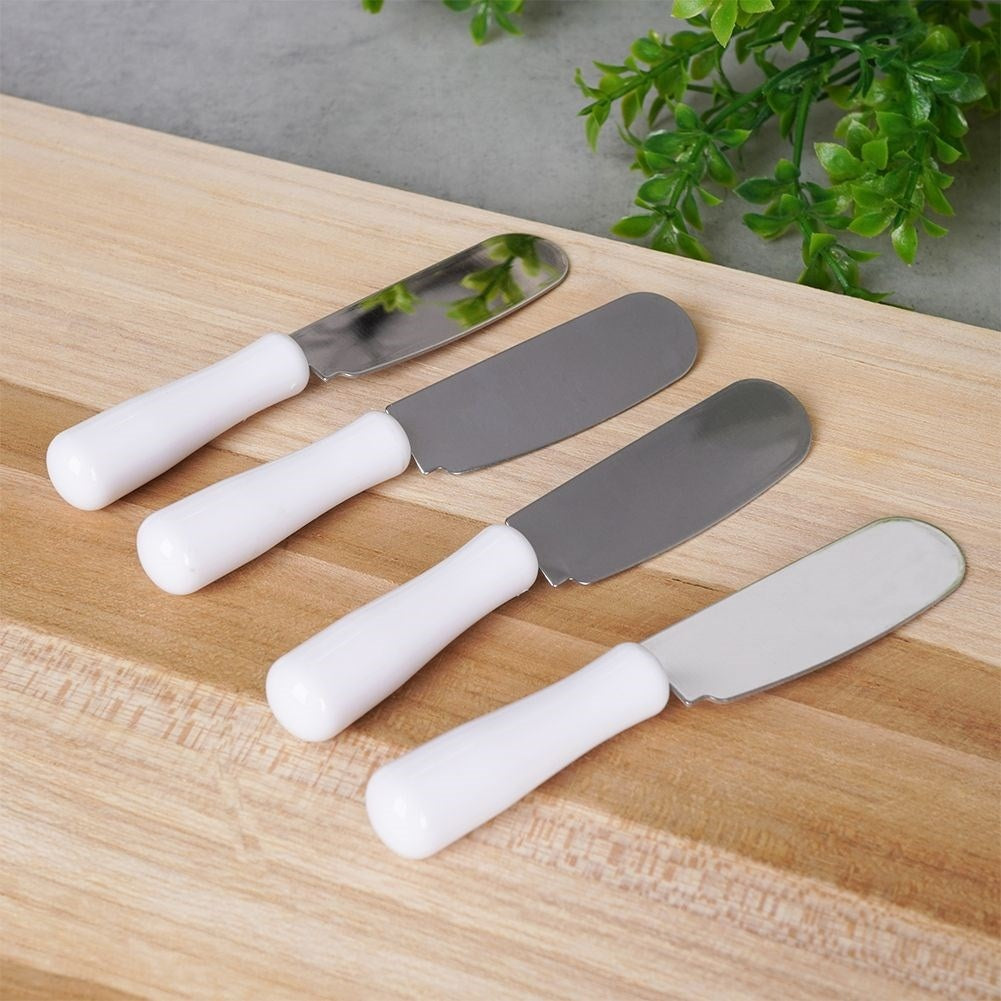 Four stainless steel knives for butter, cheeses and toppings