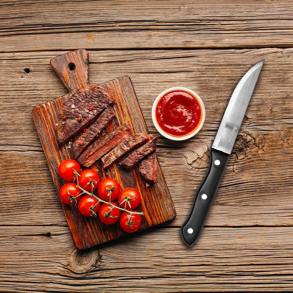 Four steak knives with serrated blades and comfortable handles