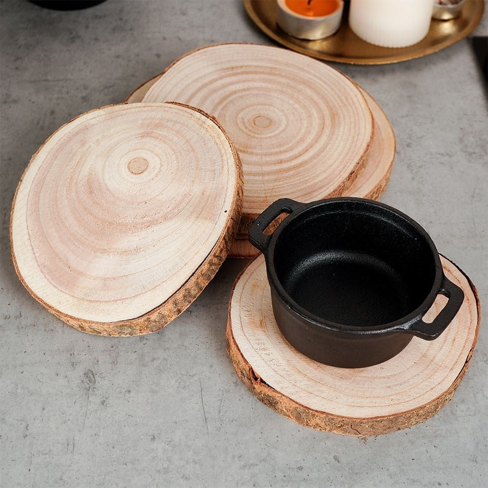 Four wooden boards with bark - natural coasters for cups and candles