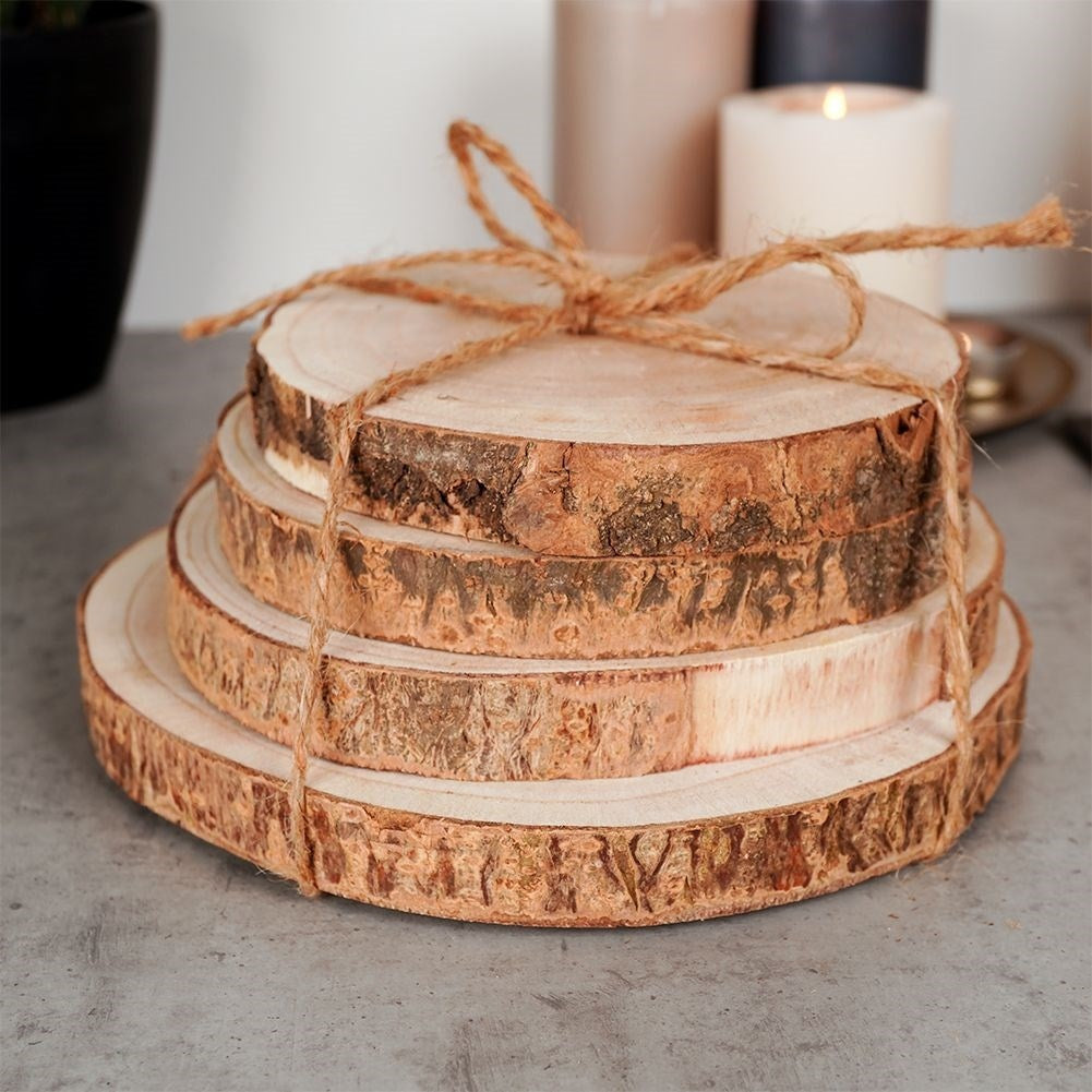 Four wooden boards with bark - natural coasters for cups and candles
