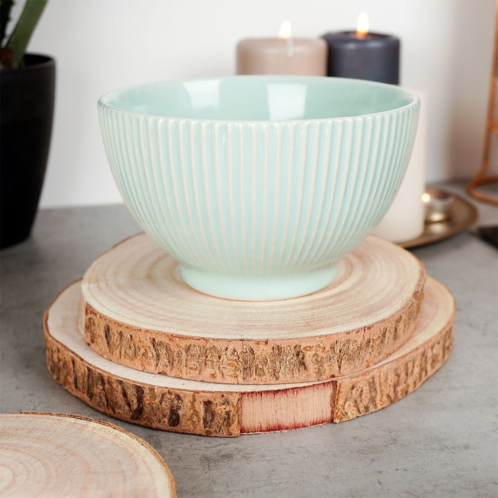 Four wooden boards with bark - natural coasters for cups and candles