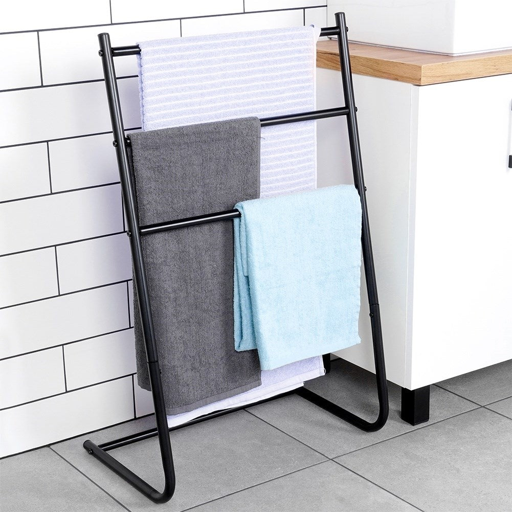 Freestanding black towel rack with three cross bars