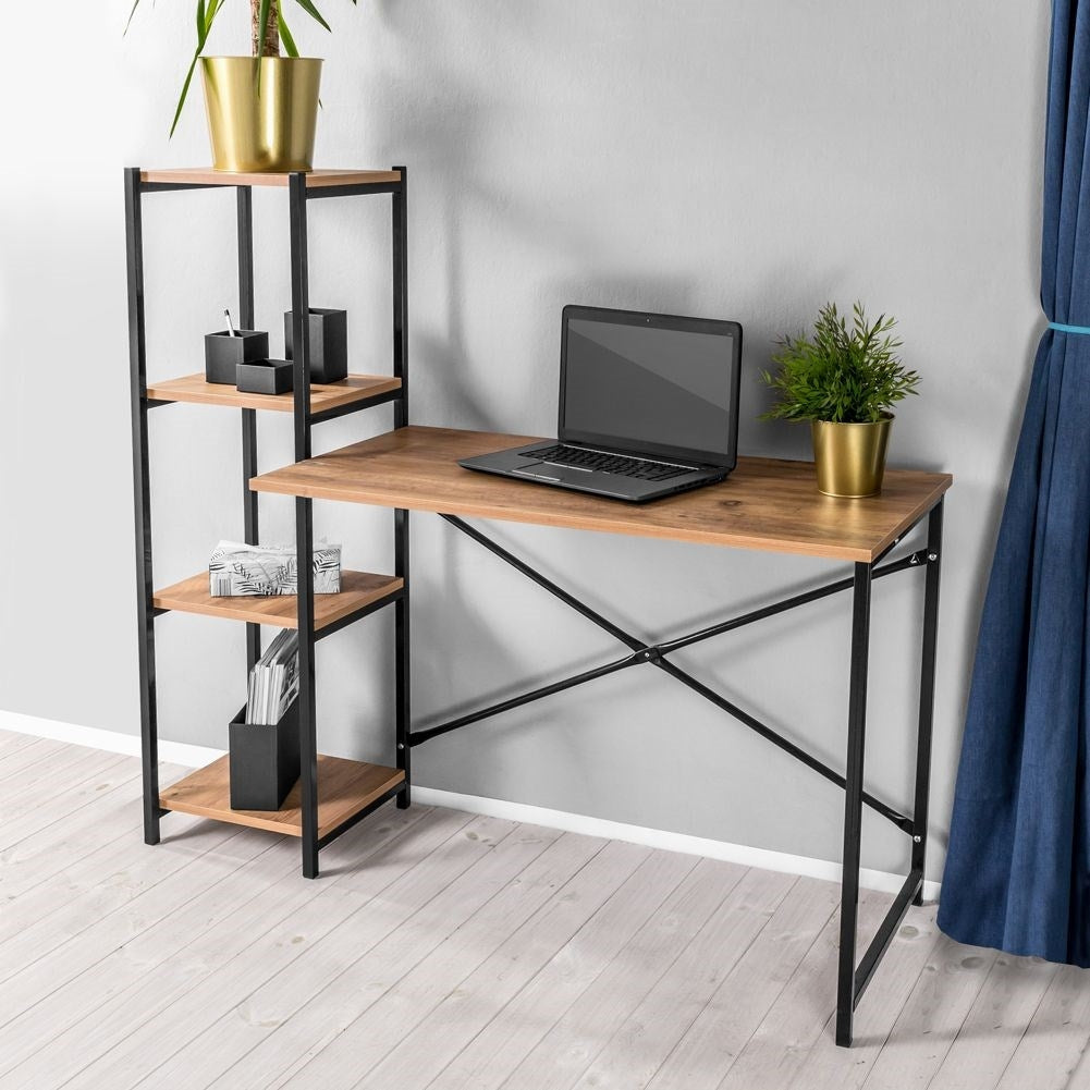 Freestanding desk with tall bookshelf for office.