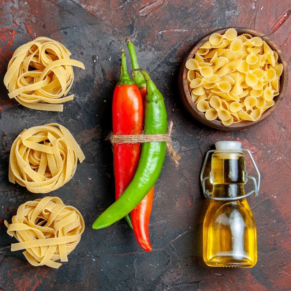 Glass bottle for oil/vinegar with garlic, herbs & chilli