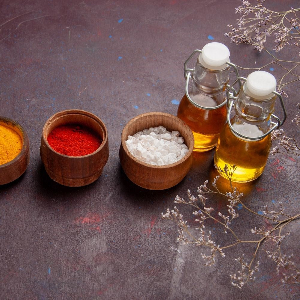 Glass bottle for oil/vinegar with garlic, herbs & chilli