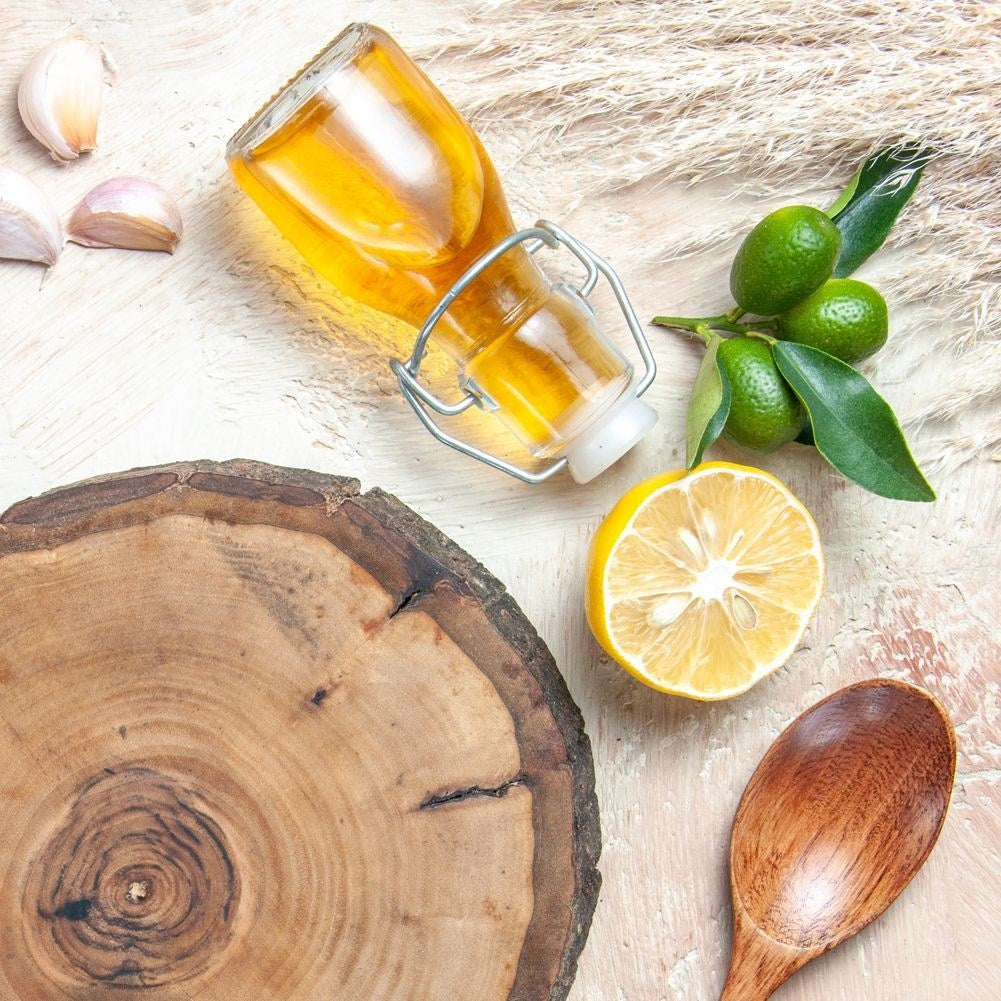 Glass bottle for oil/vinegar with garlic, herbs & chilli