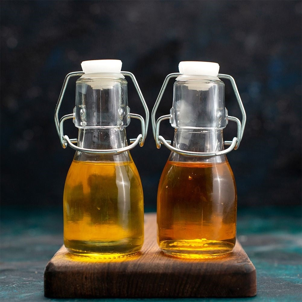 Glass bottle for oil/vinegar with garlic, herbs & chilli