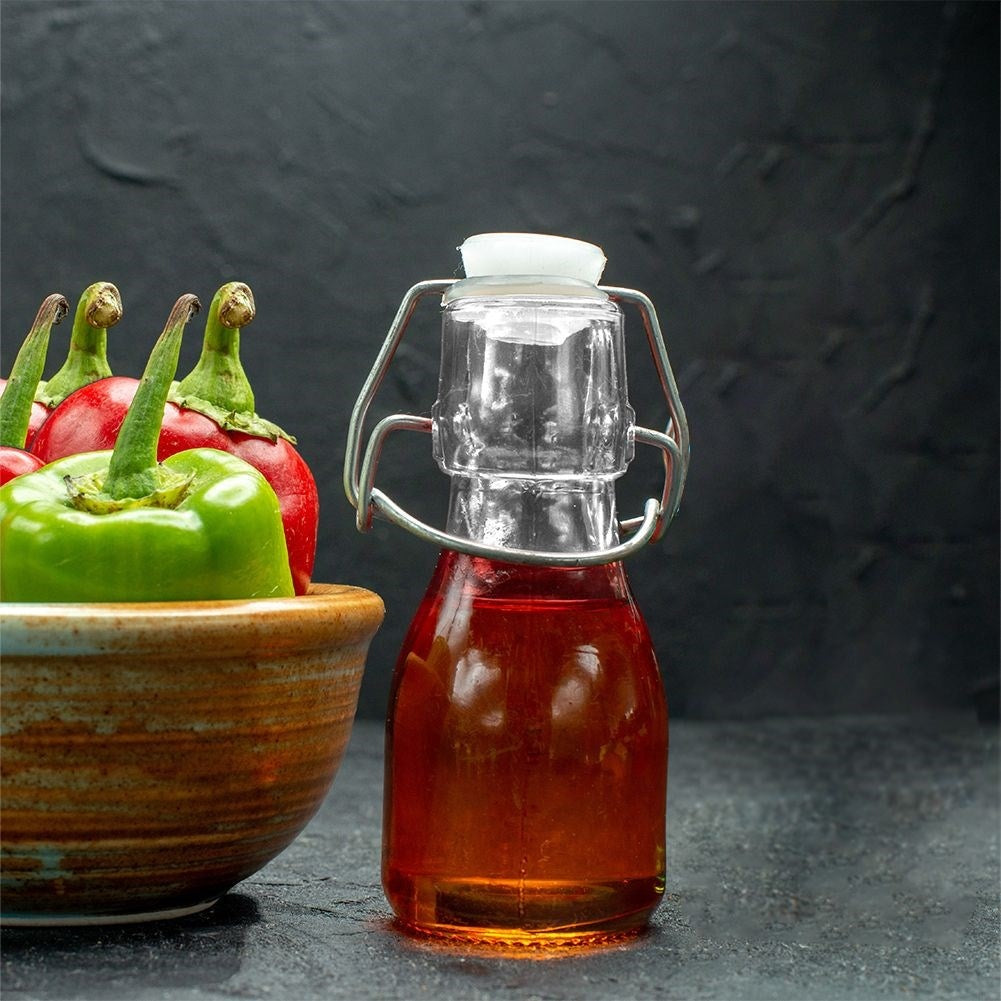 Glass bottle for oil/vinegar with garlic, herbs & chilli