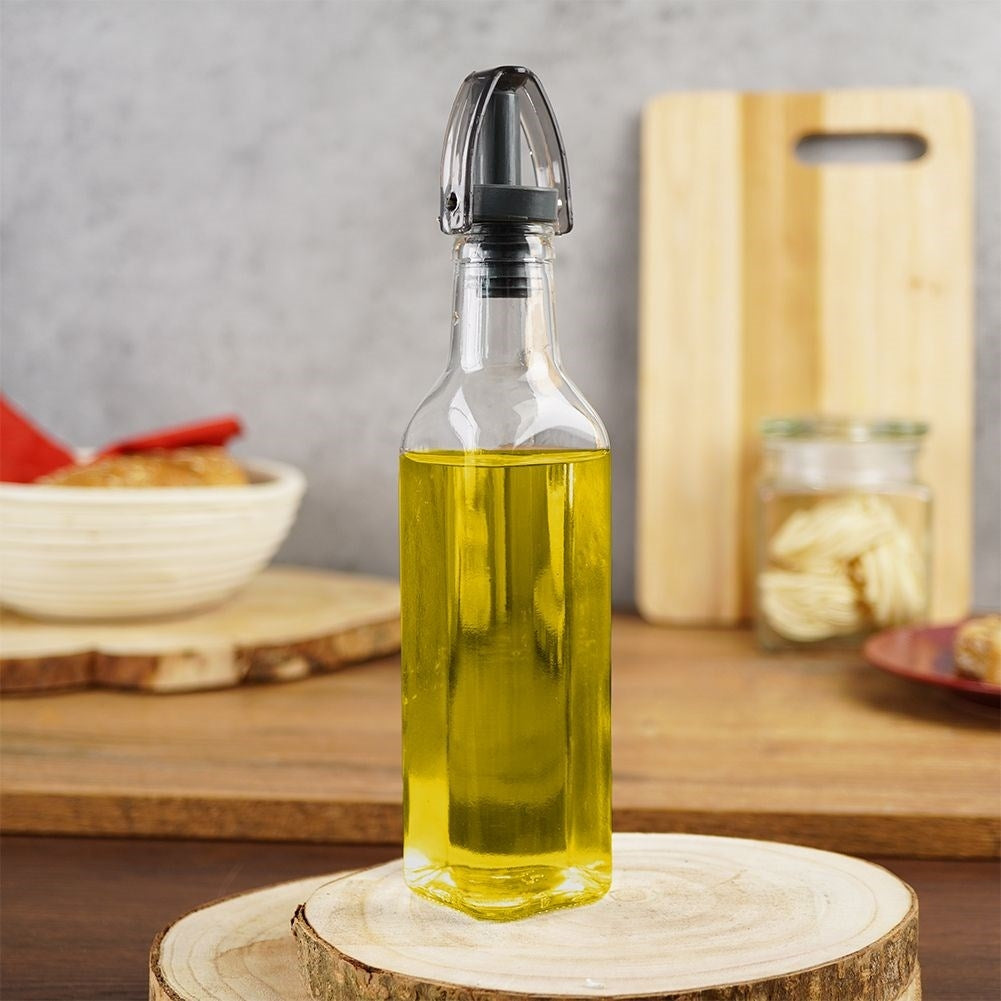 Glass bottle for oil/vinegar with pouring spout and cap