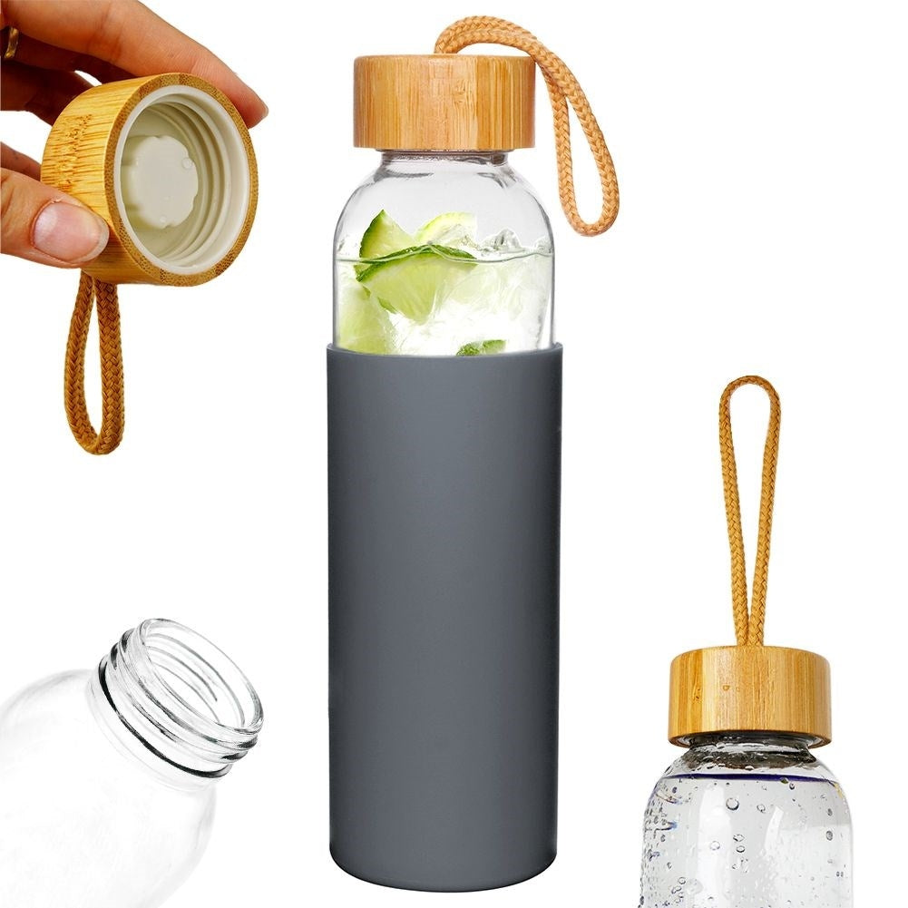 Glass bottle with silicone cover and wooden cork for drinks