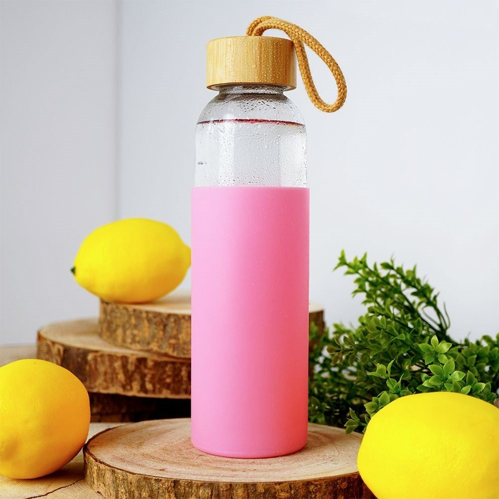 Glass bottle with silicone cover and wooden lid
