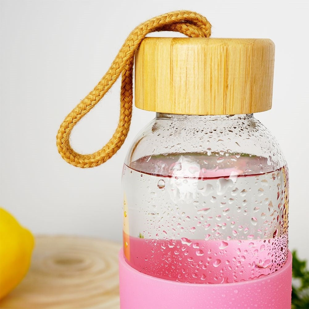 Glass bottle with silicone cover and wooden lid