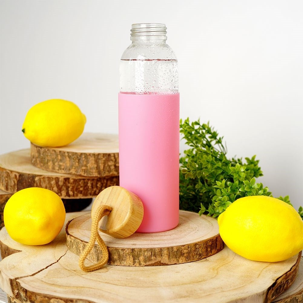 Glass bottle with silicone cover and wooden lid