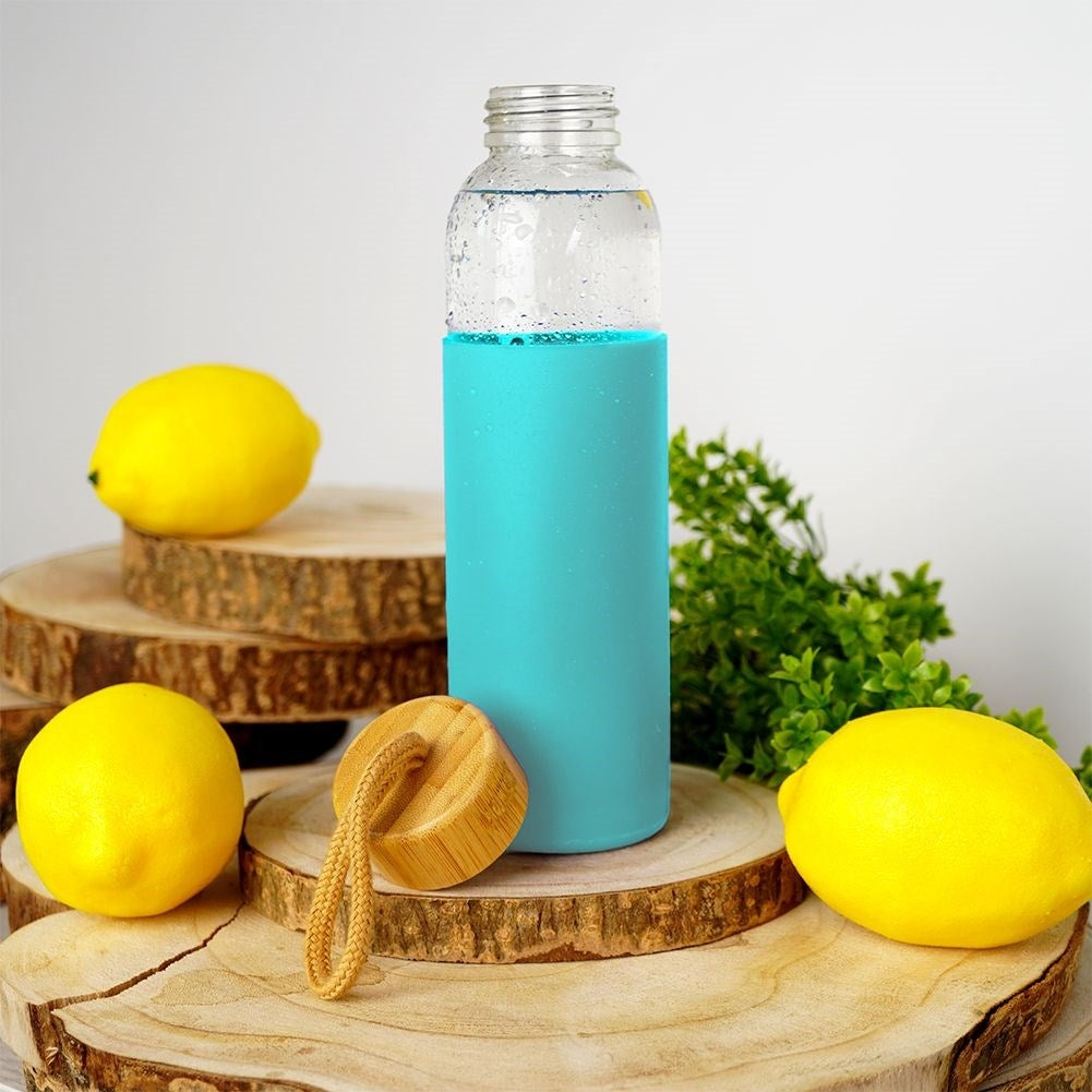 Glass bottle with silicone protection and wooden lid for drinks