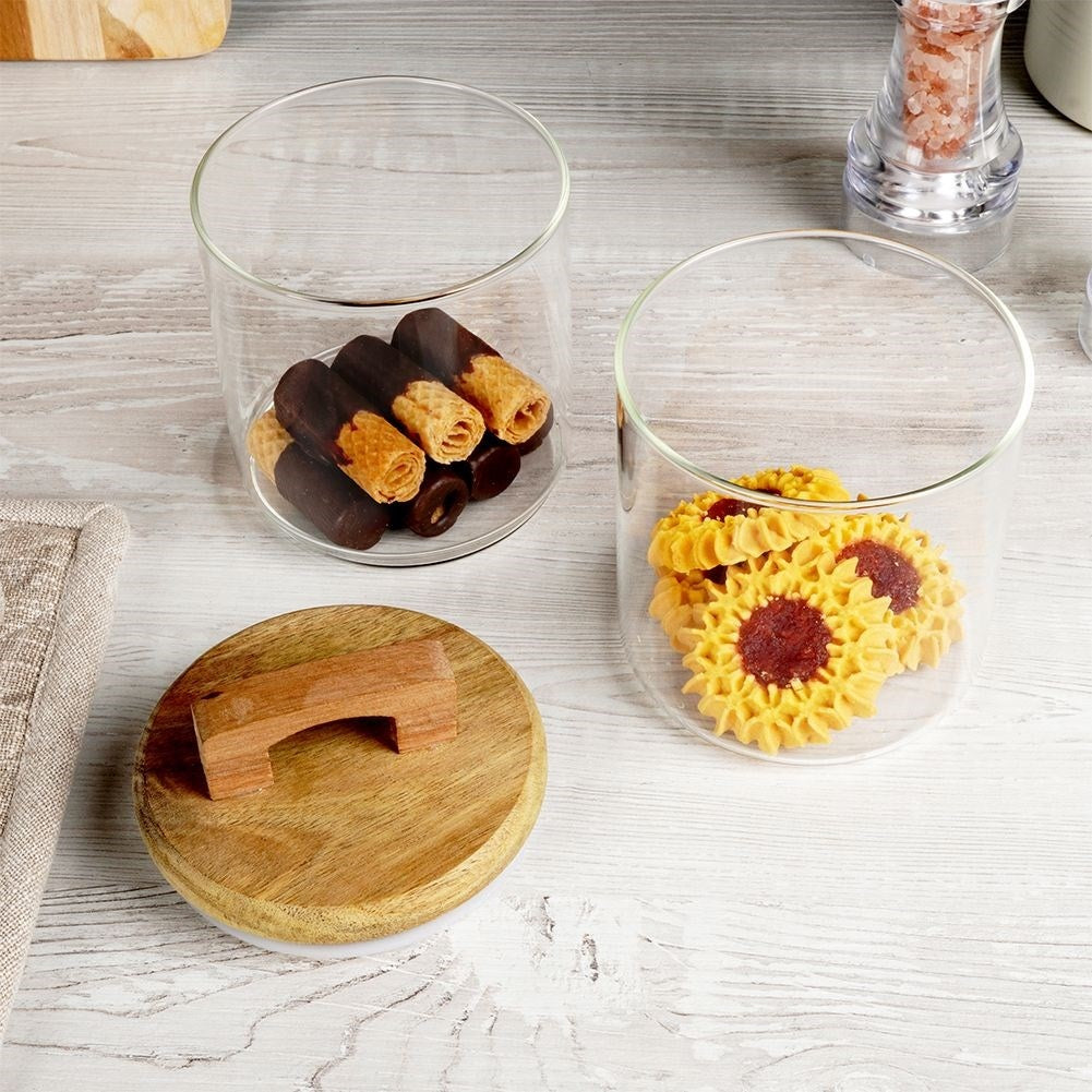 Glass container with wooden lid and silicone seal for food storage