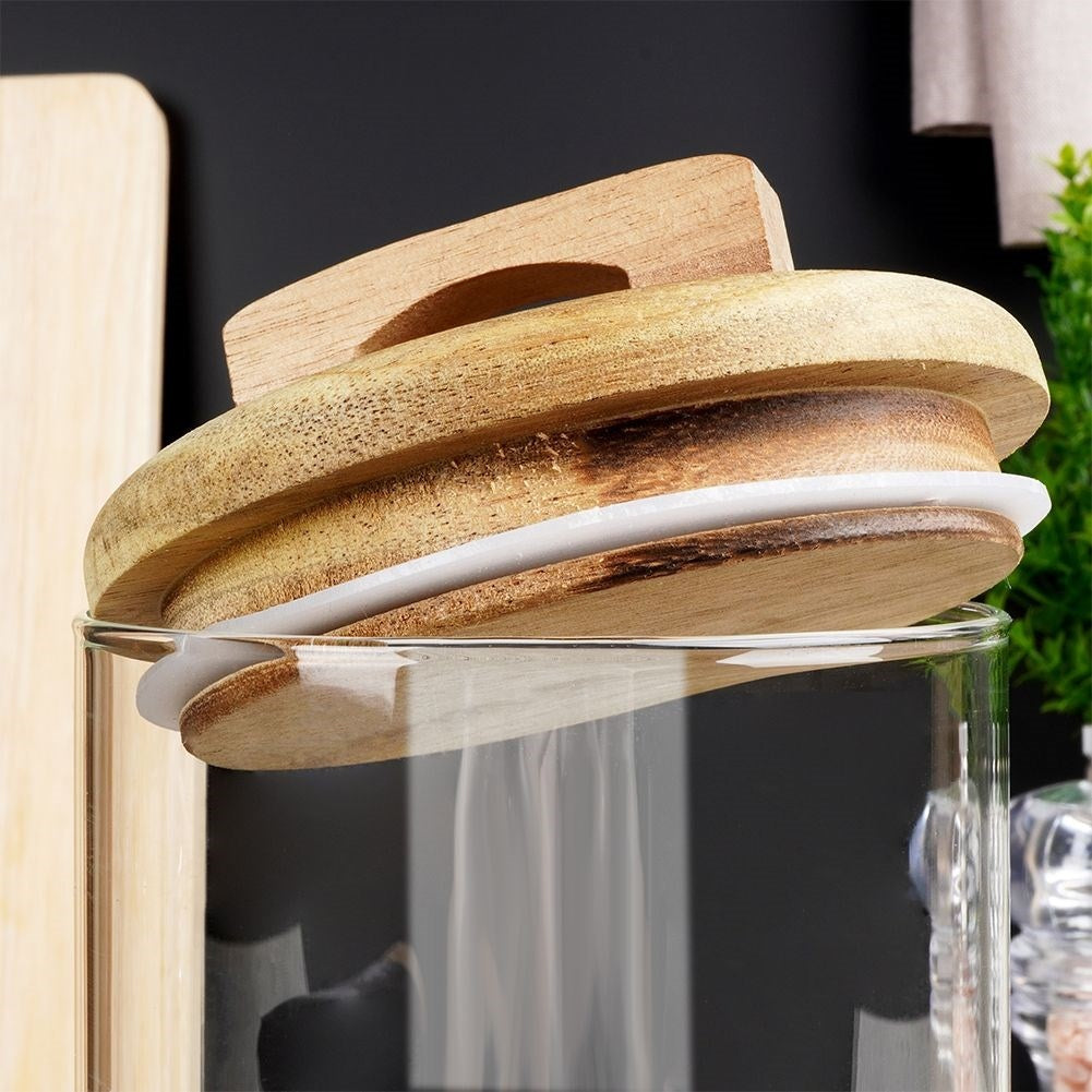 Glass container with wooden lid and silicone seal for food storage