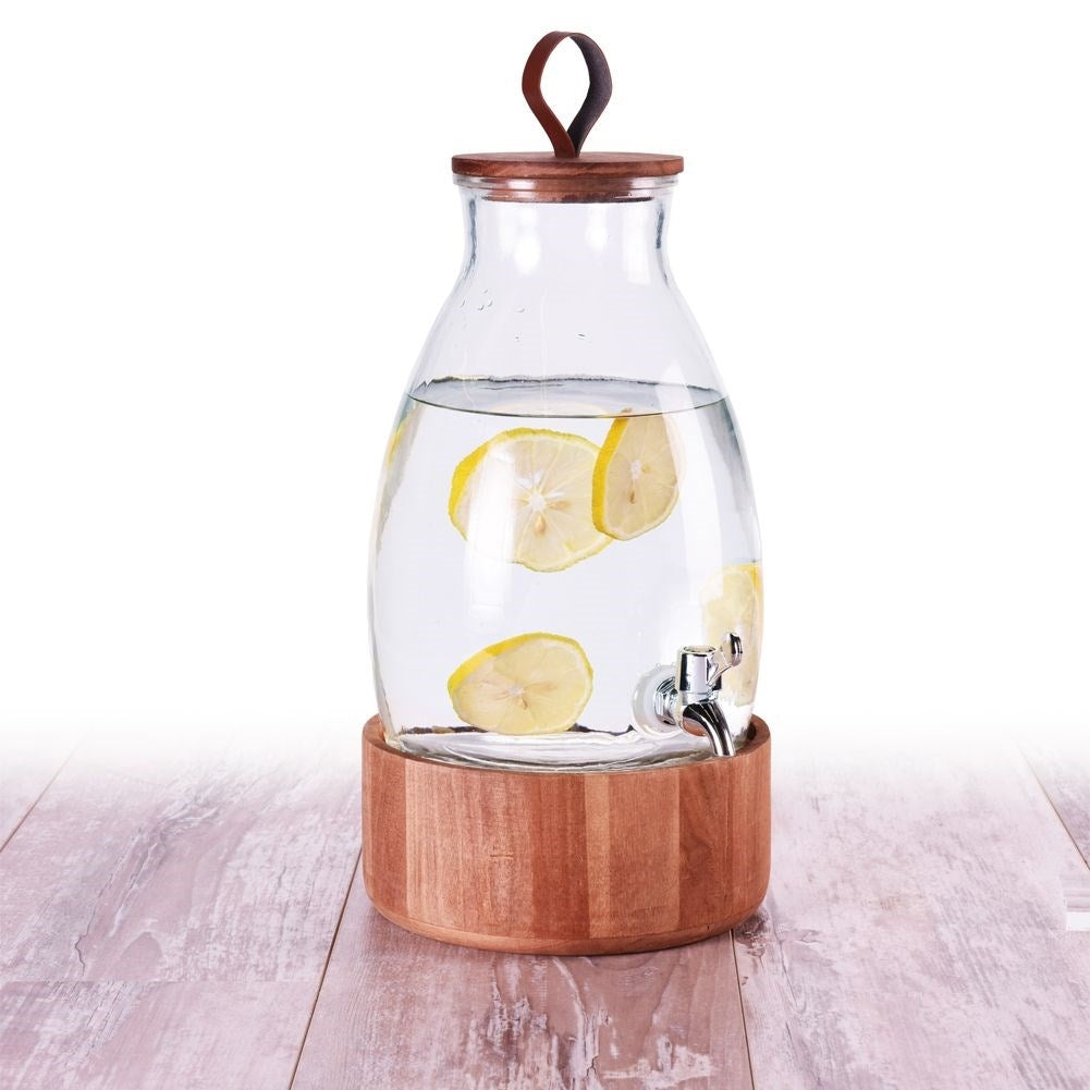 Glass jar with tap and wooden stand for drinks