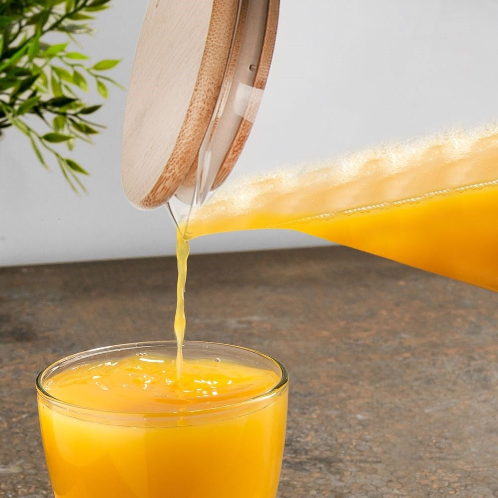 Glass jug for all drinks with handle, pouring spout and bamboo lid