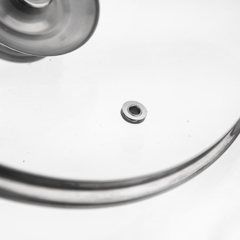 Glass lid with steel edge and steam opening for pots and pans
