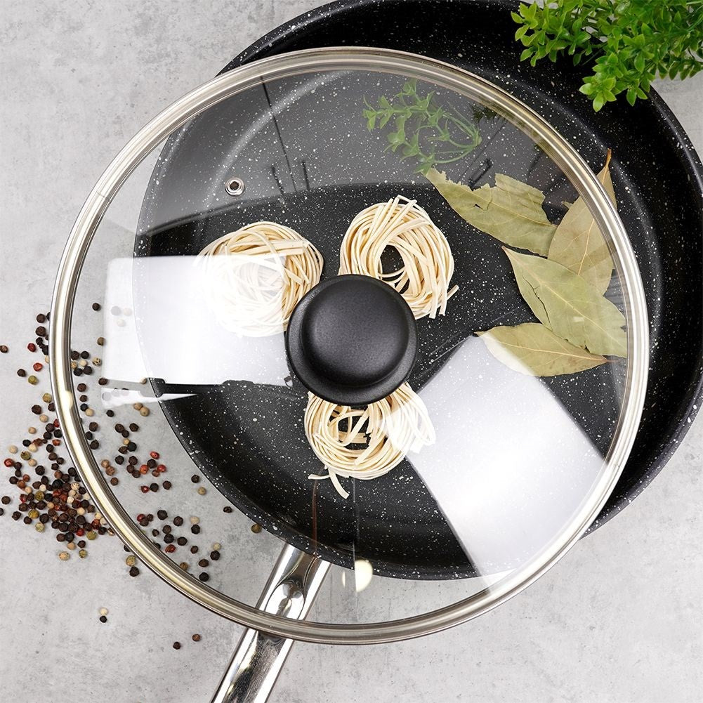 Glass lid with steel edge, plastic grip and steam outlet