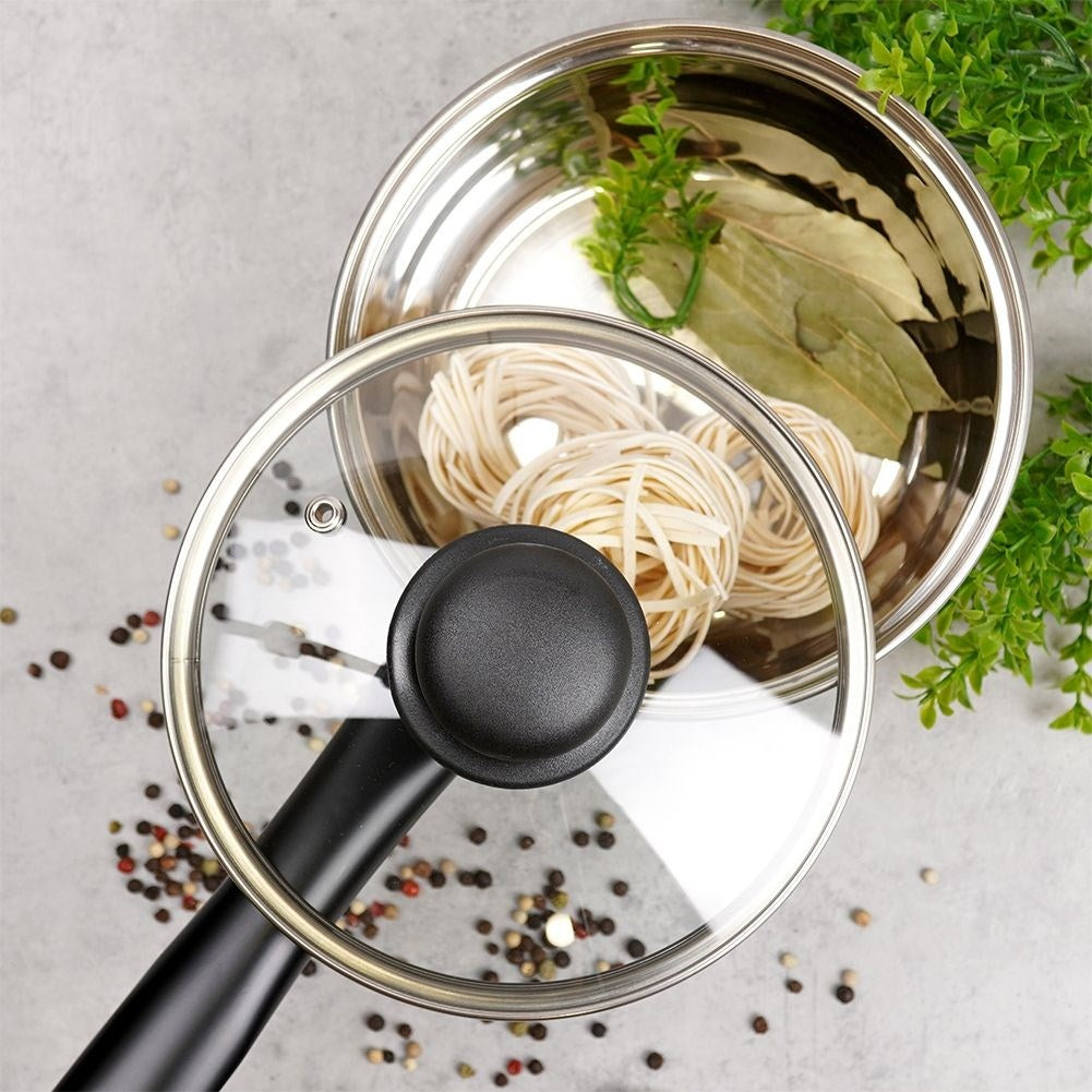 Glass lid with steel edge, plastic handle and steam outlet