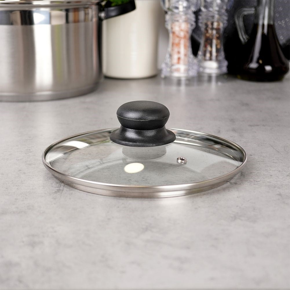 Glass lid with steel edge, plastic handle and steam valve