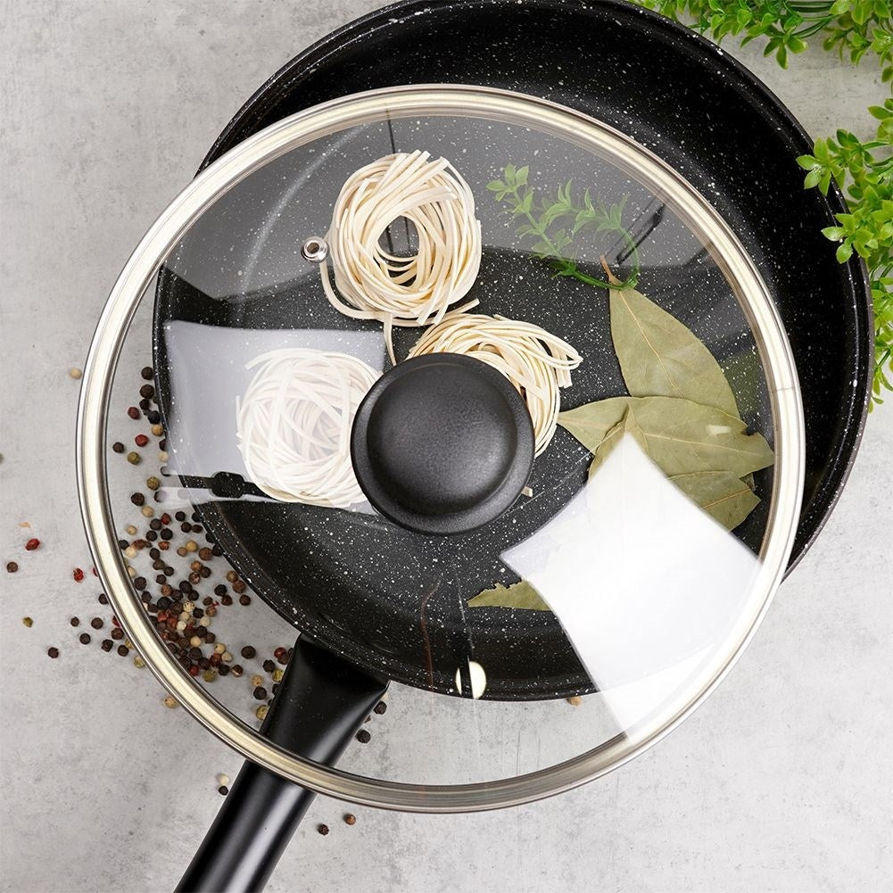 Glass lid with steel frame, plastic handle and steam opening