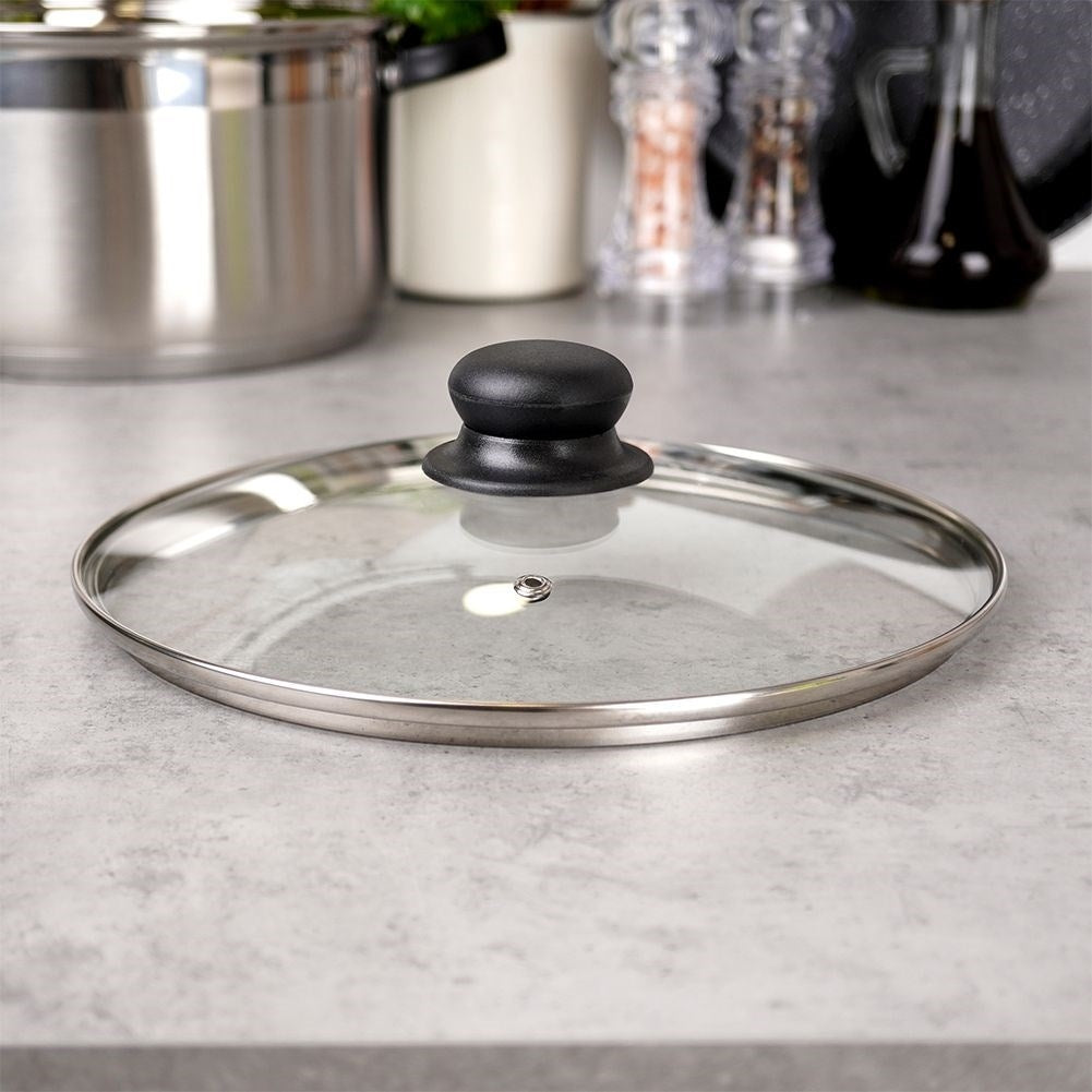 Glass lid with steel frame, plastic handle and steam opening
