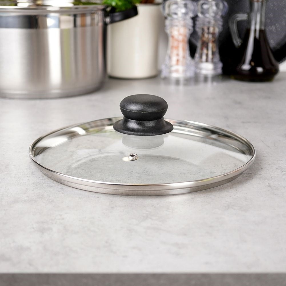 Glass lid with steel rim and plastic handle, steam valve