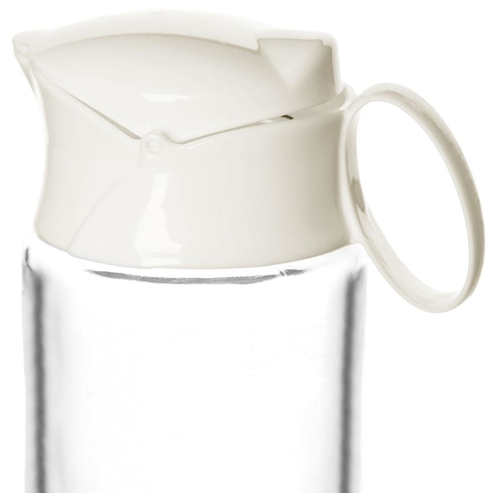 Glass milk jug with handle and spring lid for precise measurement