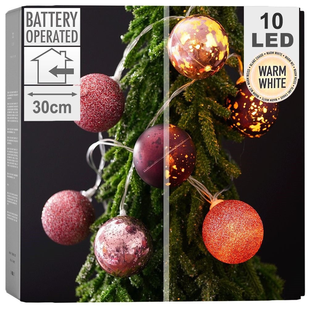 Glowing purple Christmas balls: matte, glittery, shiny, LED, indoor