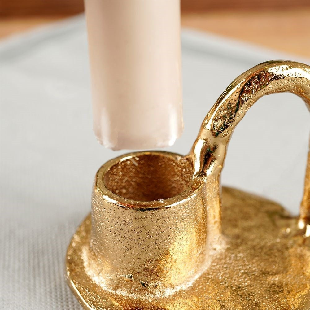 Gold colored aluminum candle holder with handle
