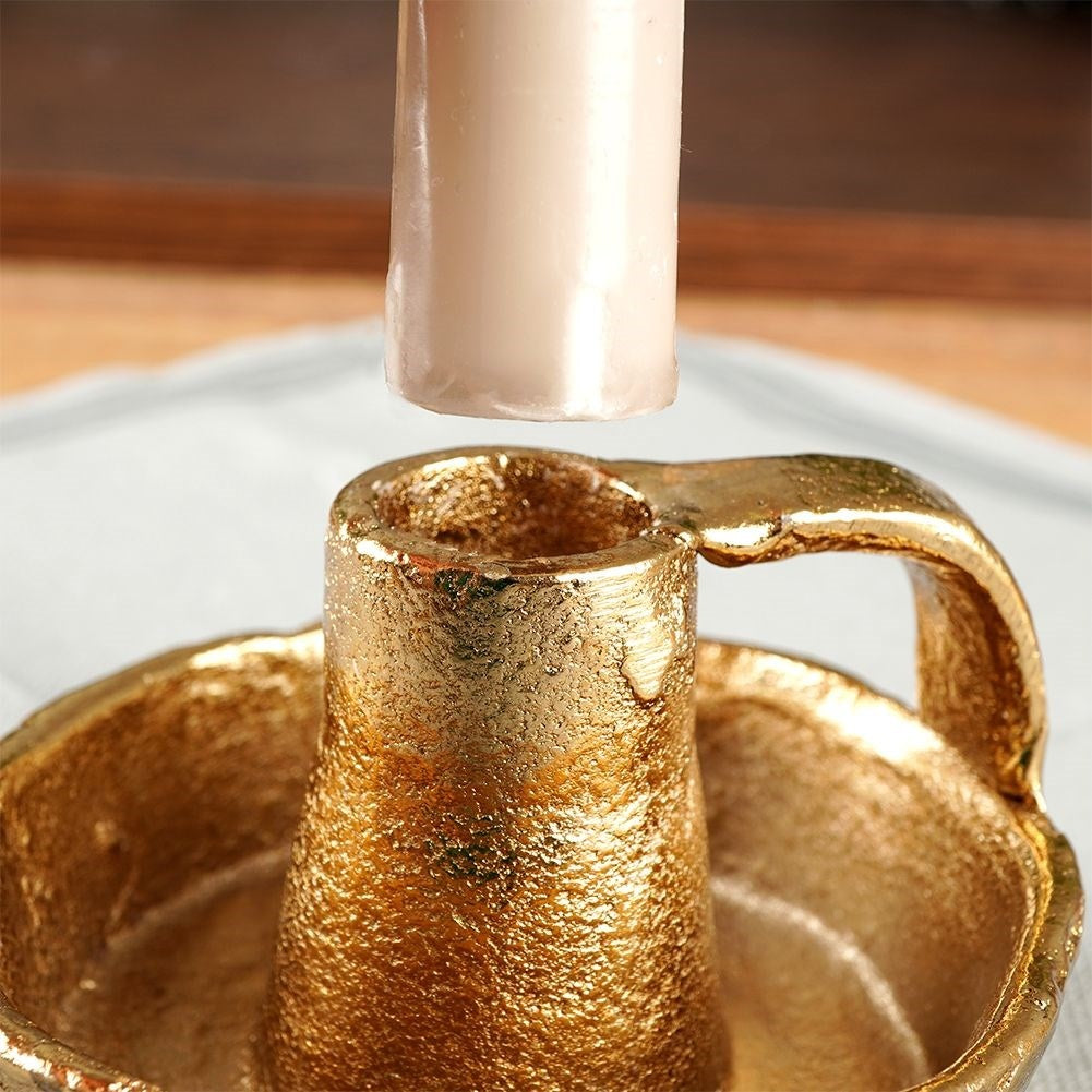 Gold colored aluminum candle holder with handle
