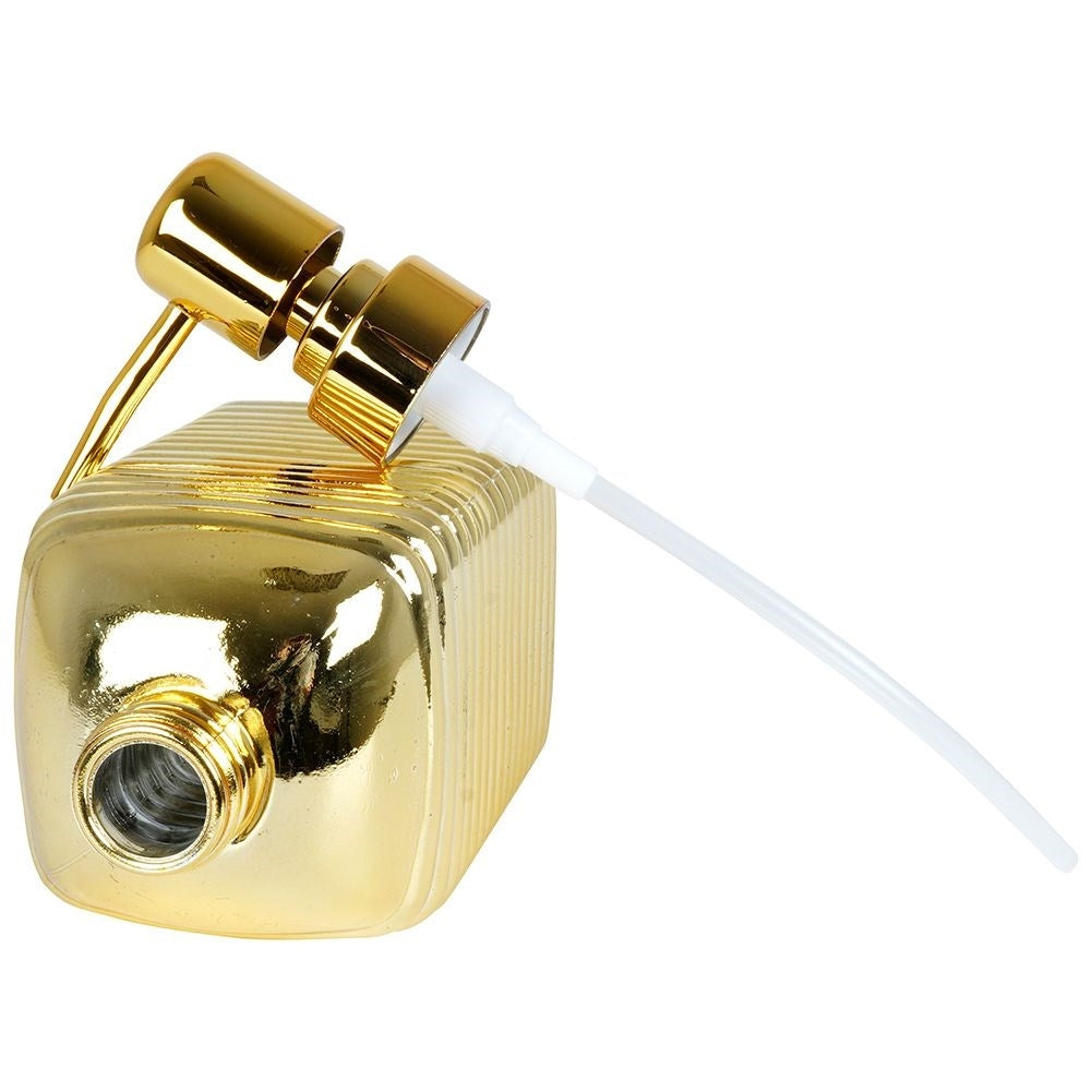 Gold colored soap pump in glass for kitchen and bathroom
