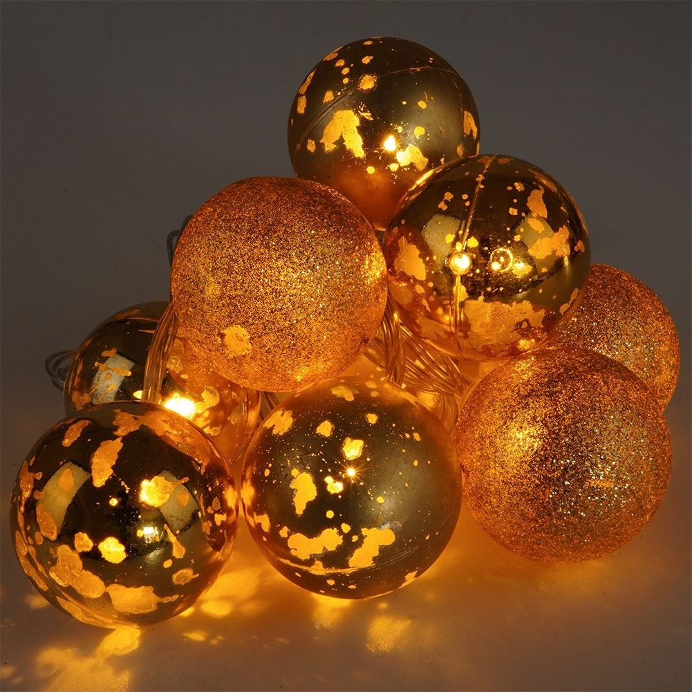 Golden LED Christmas tree balls for a festive atmosphere