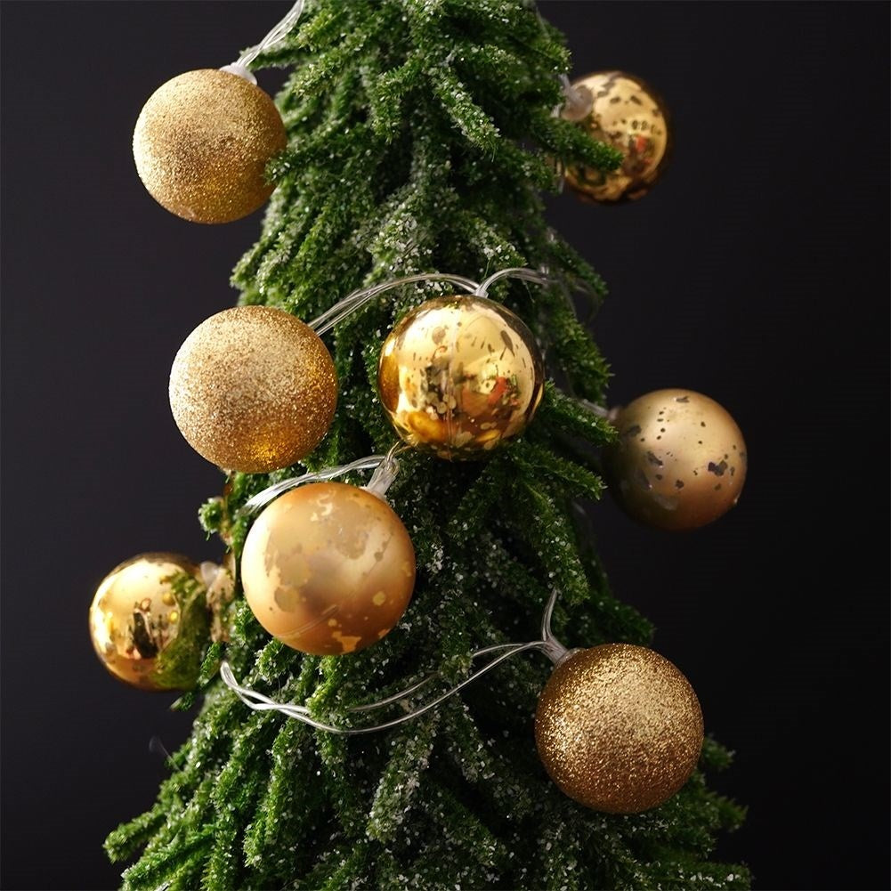 Golden LED Christmas tree balls for a festive atmosphere