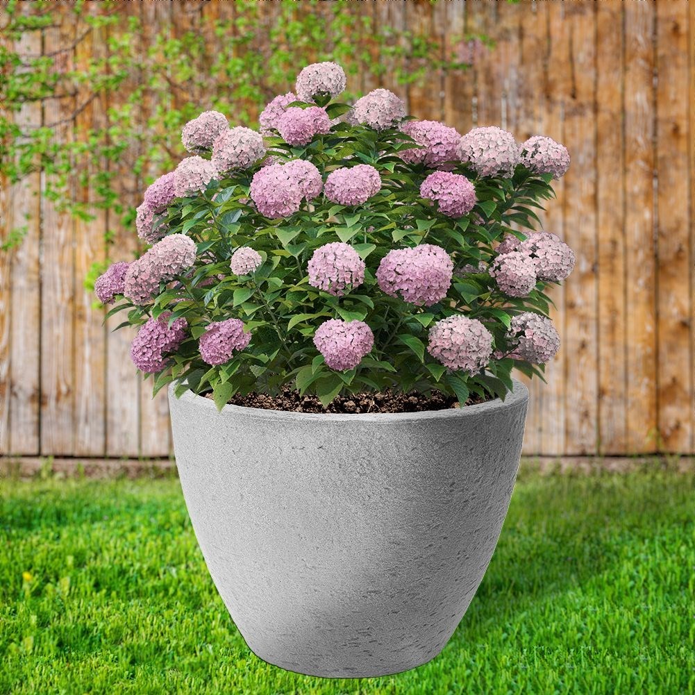 Gray plastic pot with stone look, weatherproof for outdoor use.
