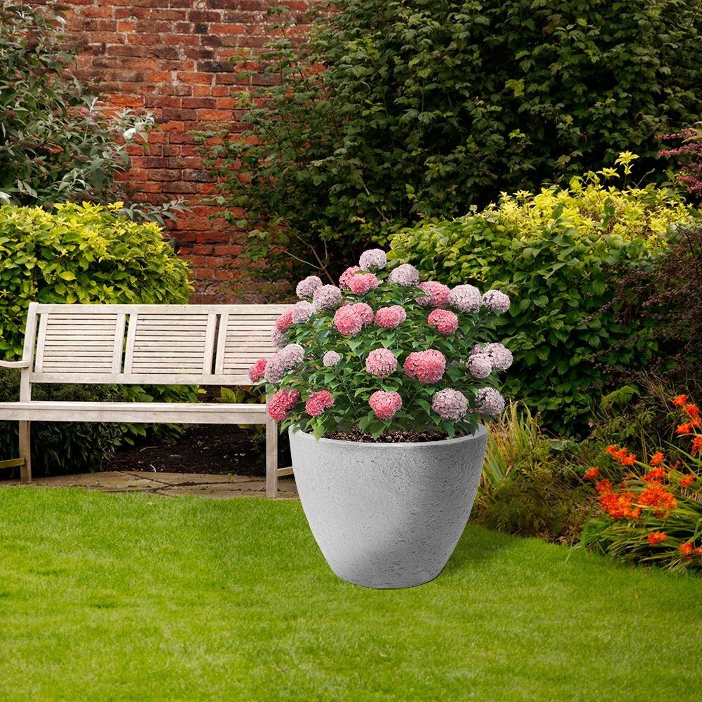 Gray plastic pot with stone look, weatherproof for outdoor use.
