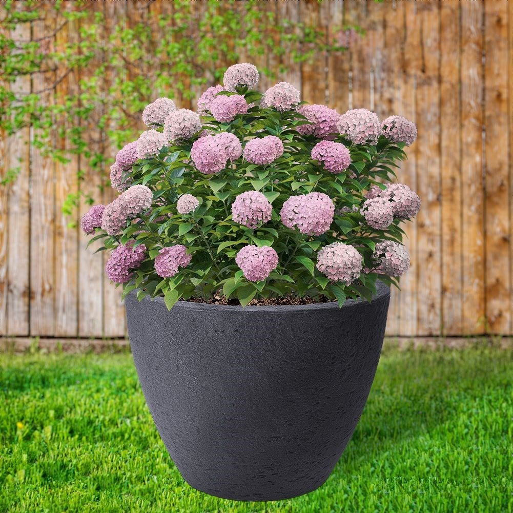 Gray weatherproof flower pot in stone imitation for garden