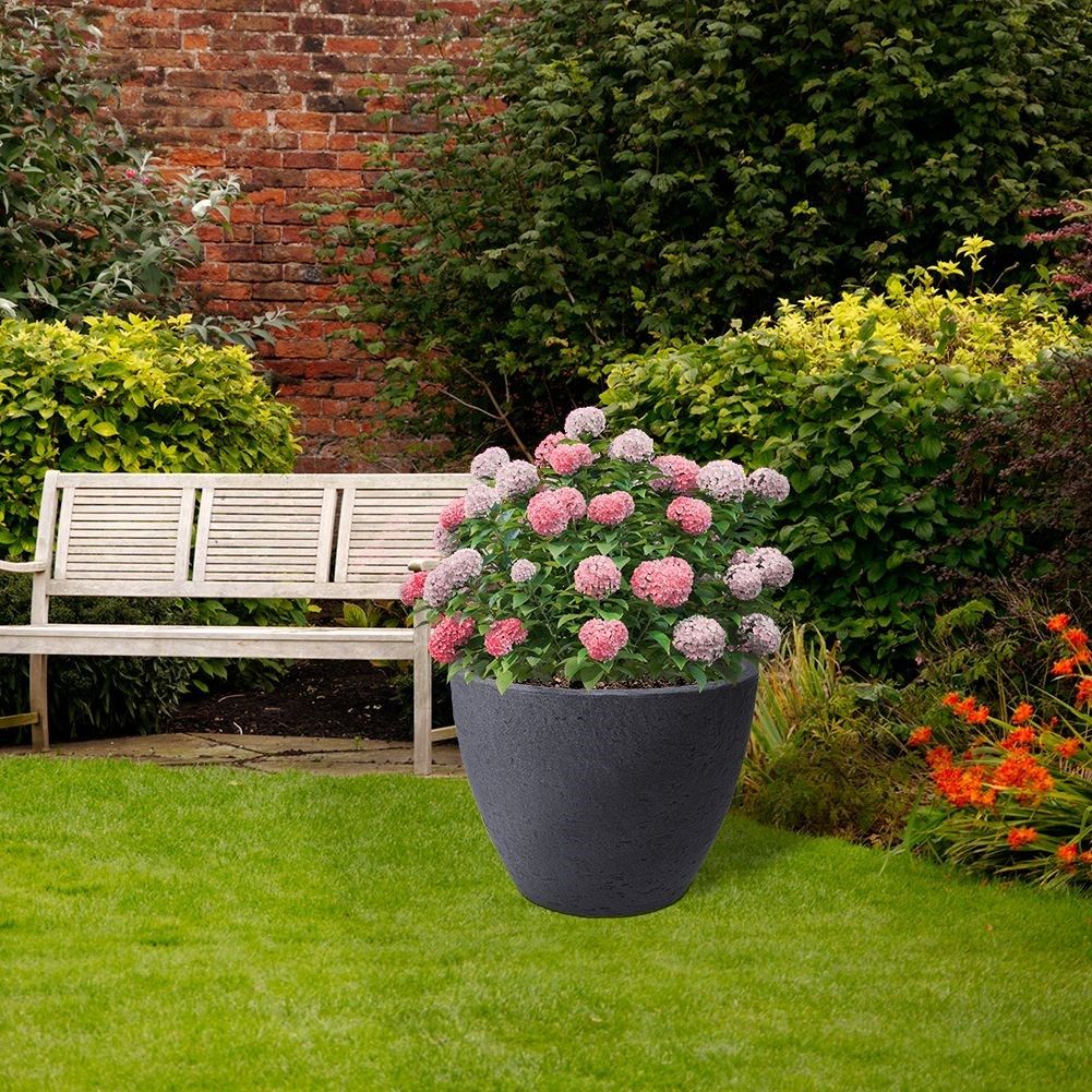 Gray weatherproof flower pot in stone imitation for garden