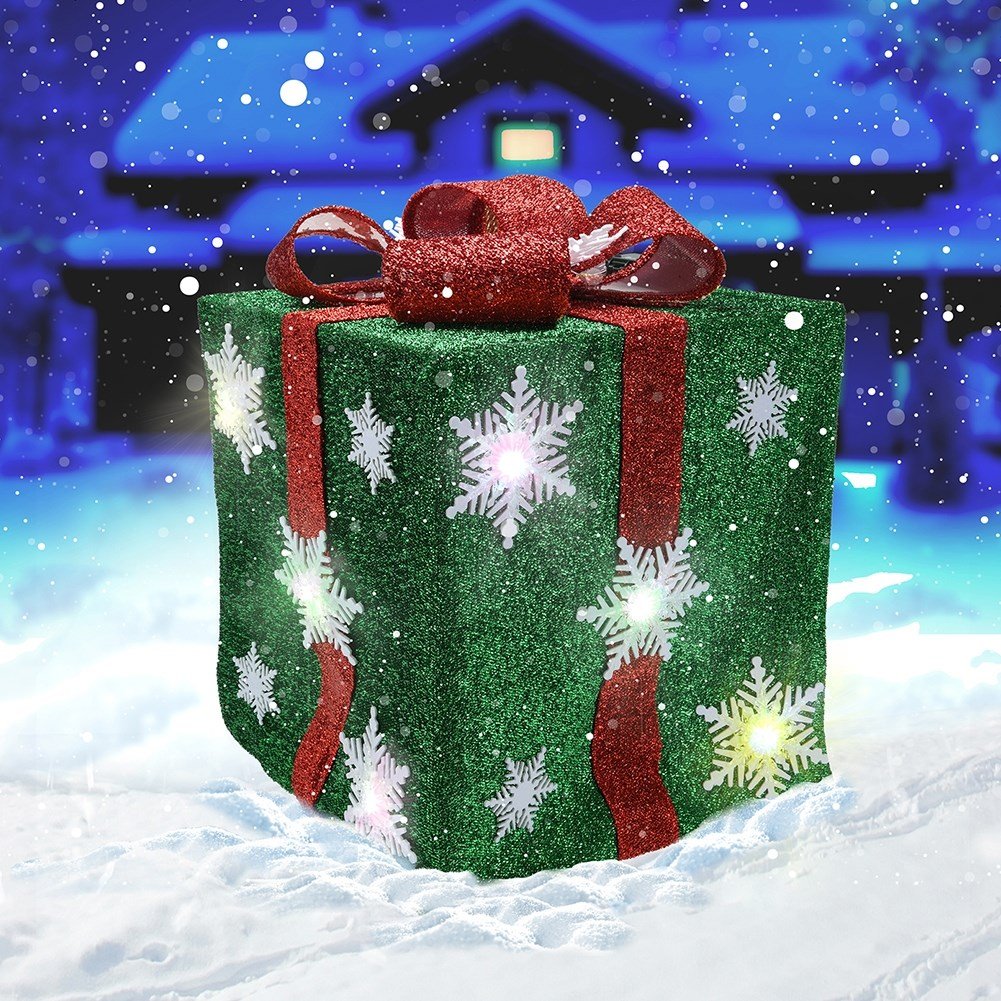 Green Christmas gift with red bow, white snowflakes and LED lights