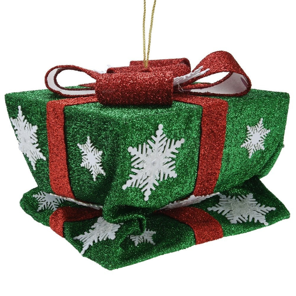 Green Christmas gift with red bow, white snowflakes and LED lights