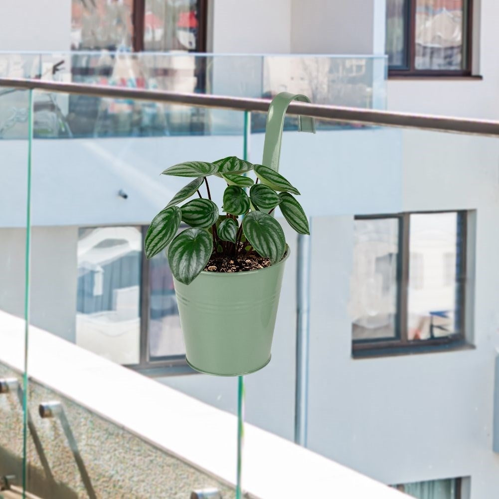 Green metal pot with handle for balcony or terrace