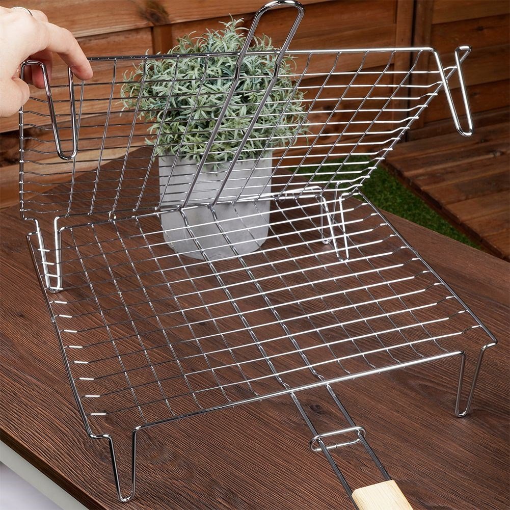 Grill grate with legs and wooden handle for easy grilling