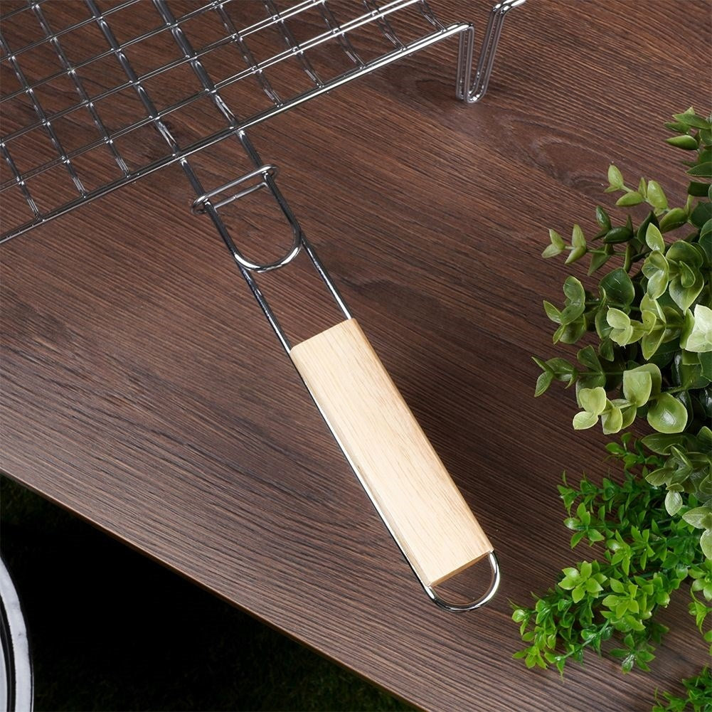 Grill grate with legs and wooden handle for easy grilling