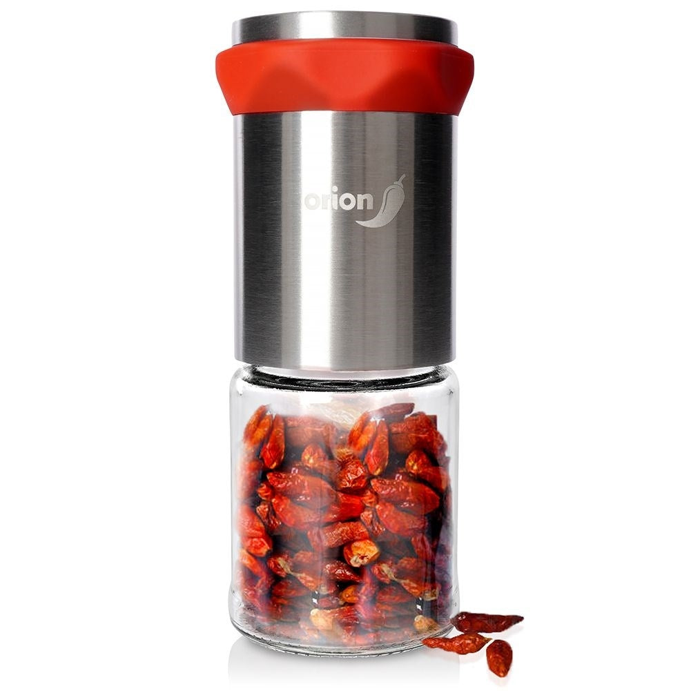Hand grinder for chili pepper with glass container and steel mechanism
