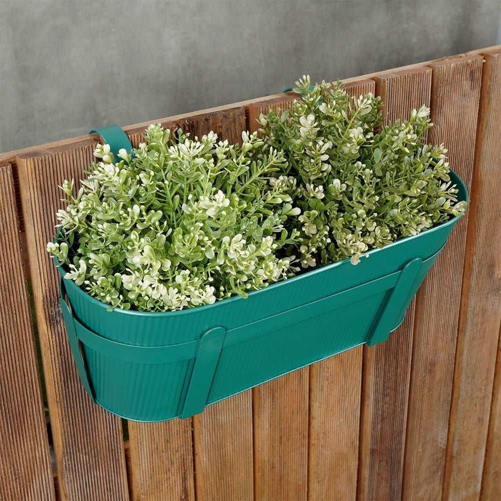 Hanging green metal pot with grooved front for balcony