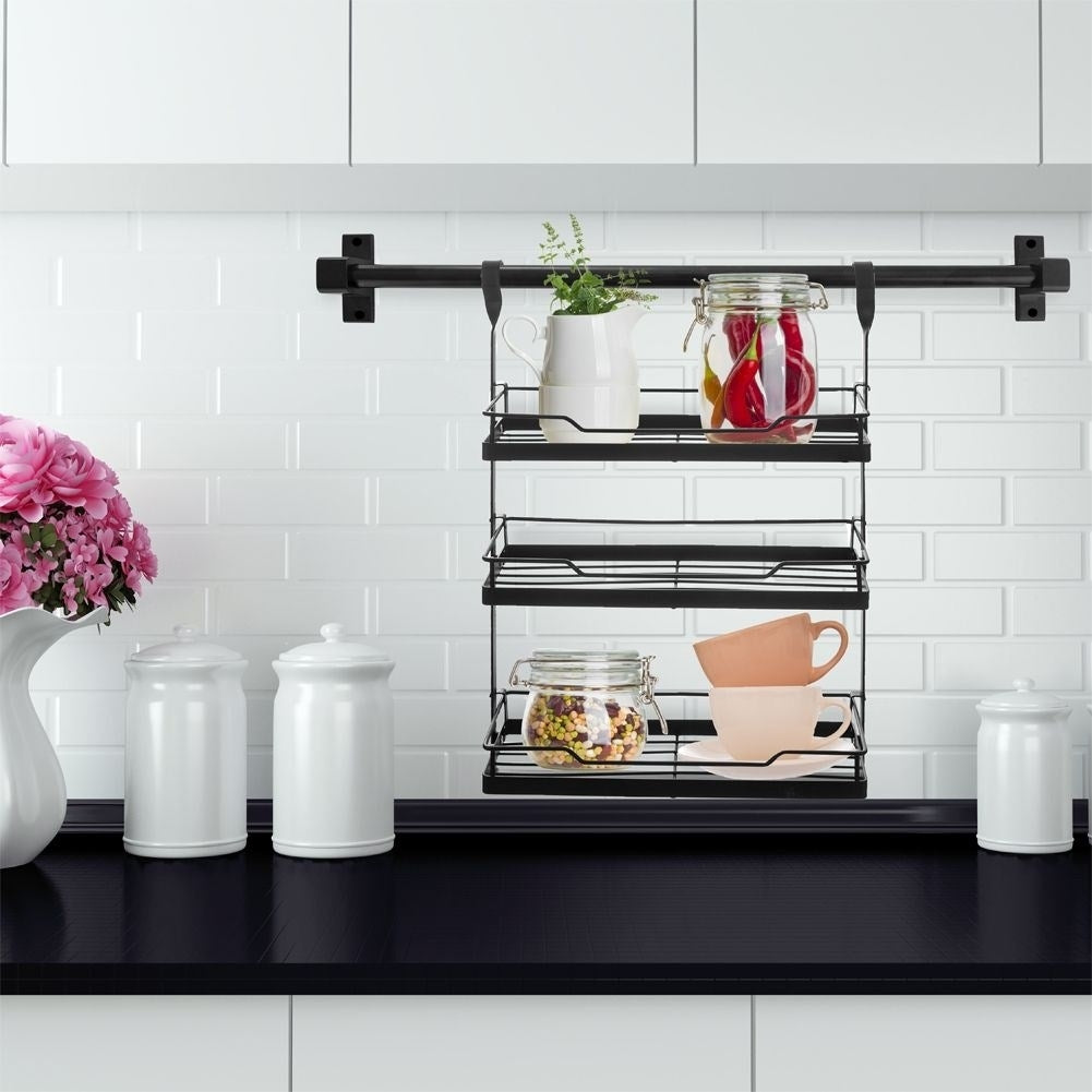 Hanging kitchen shelf in black metal for spices and herbs