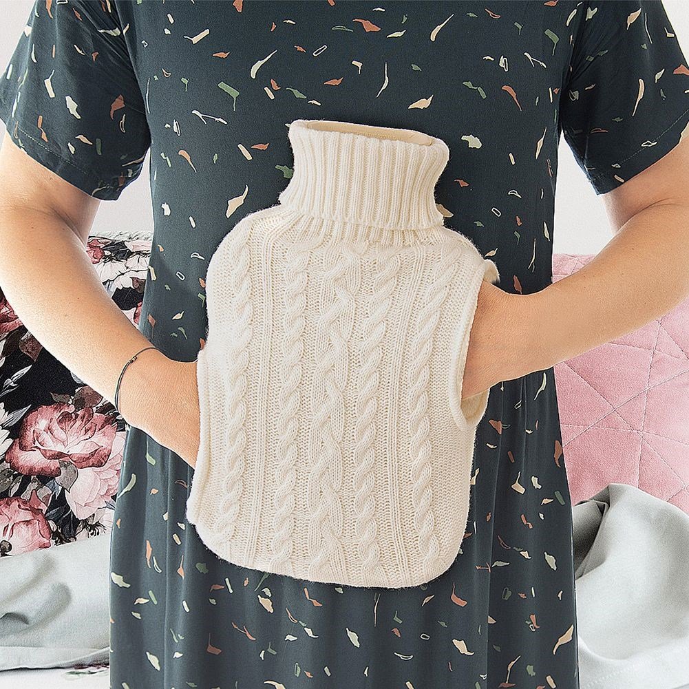 Heating bottle with cozy knitted beige cover